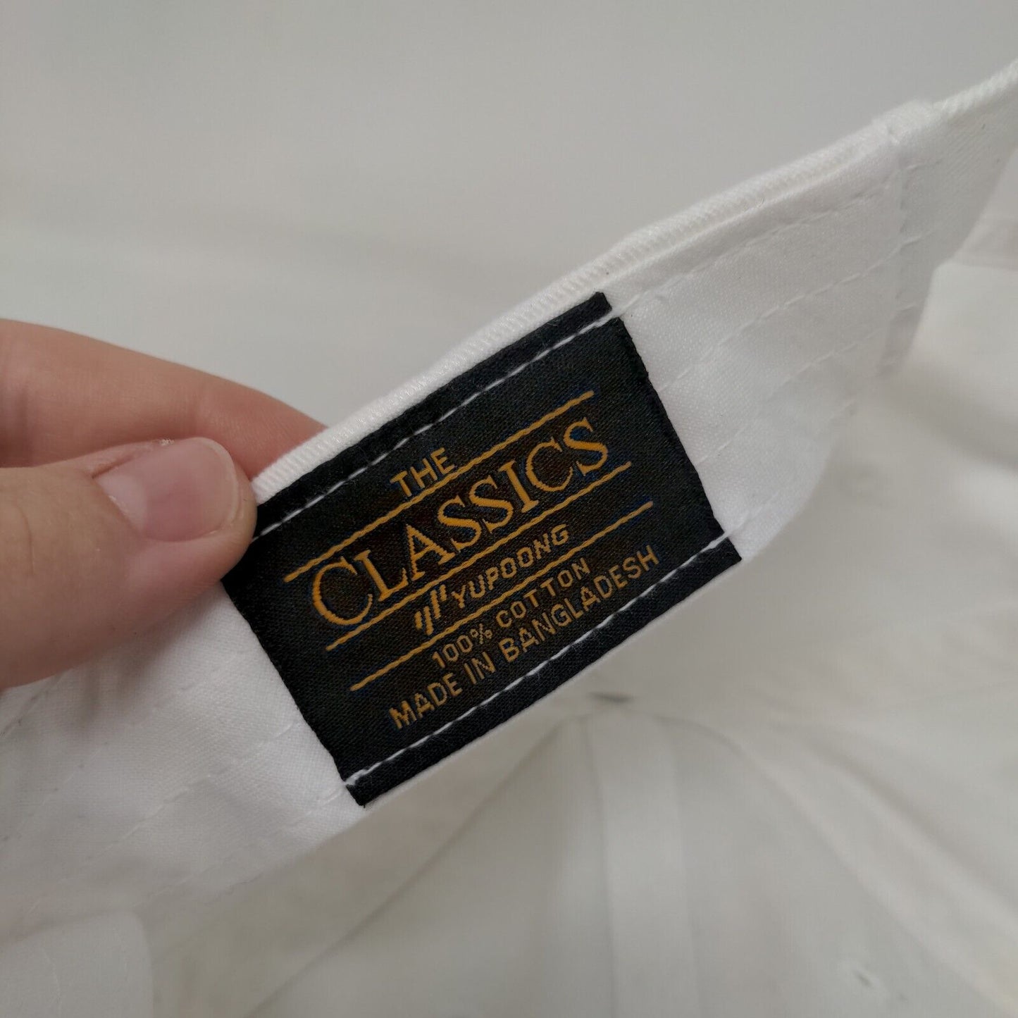 The Classics Yupoong Slideback Hat White One Size Ecowash Solid 6 Panel