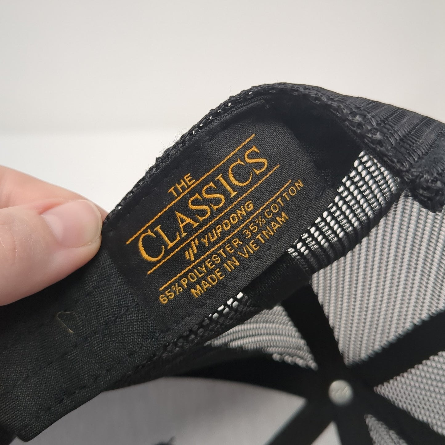 The Classics Yupoong Snapback Trucker Hat Black One Size Embroidered