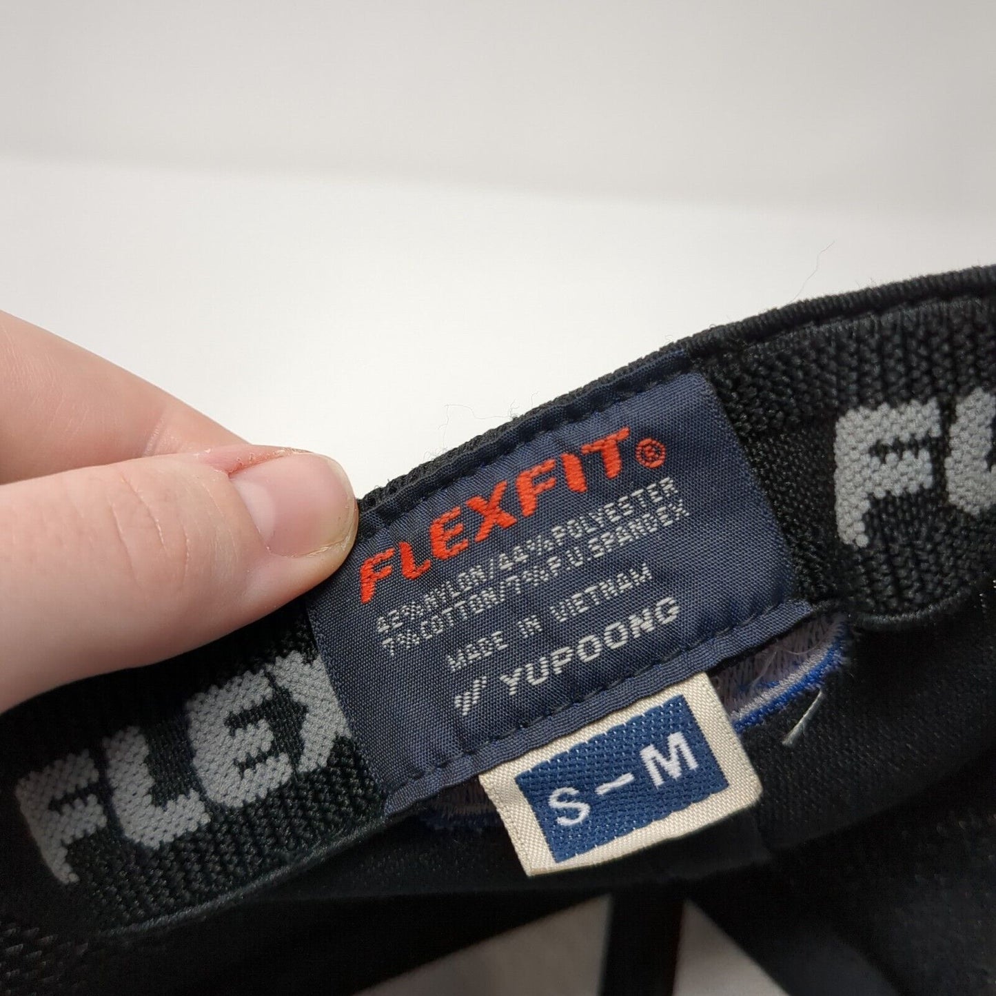 Sigler Carrier Turn To The Experts Fitted Trucker Hat Black S/M Flexfit Yupoong