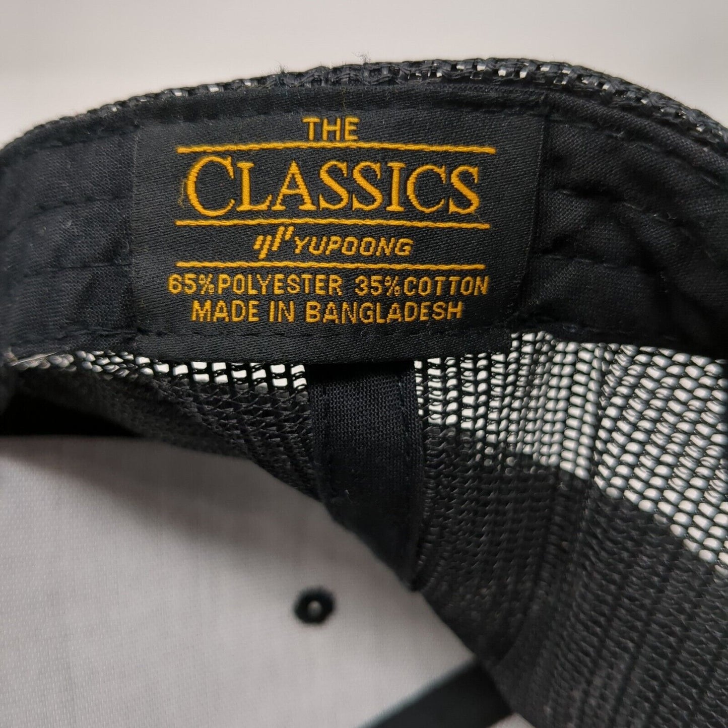 The Classics Yupoong Snapback Mesh Back Trucker Hat Black OSFA Adjustable