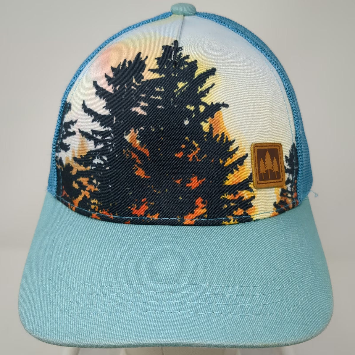 The Montana Scene Trucker Hat Blue One Size Sunset Tree Graphic Mesh Snapback
