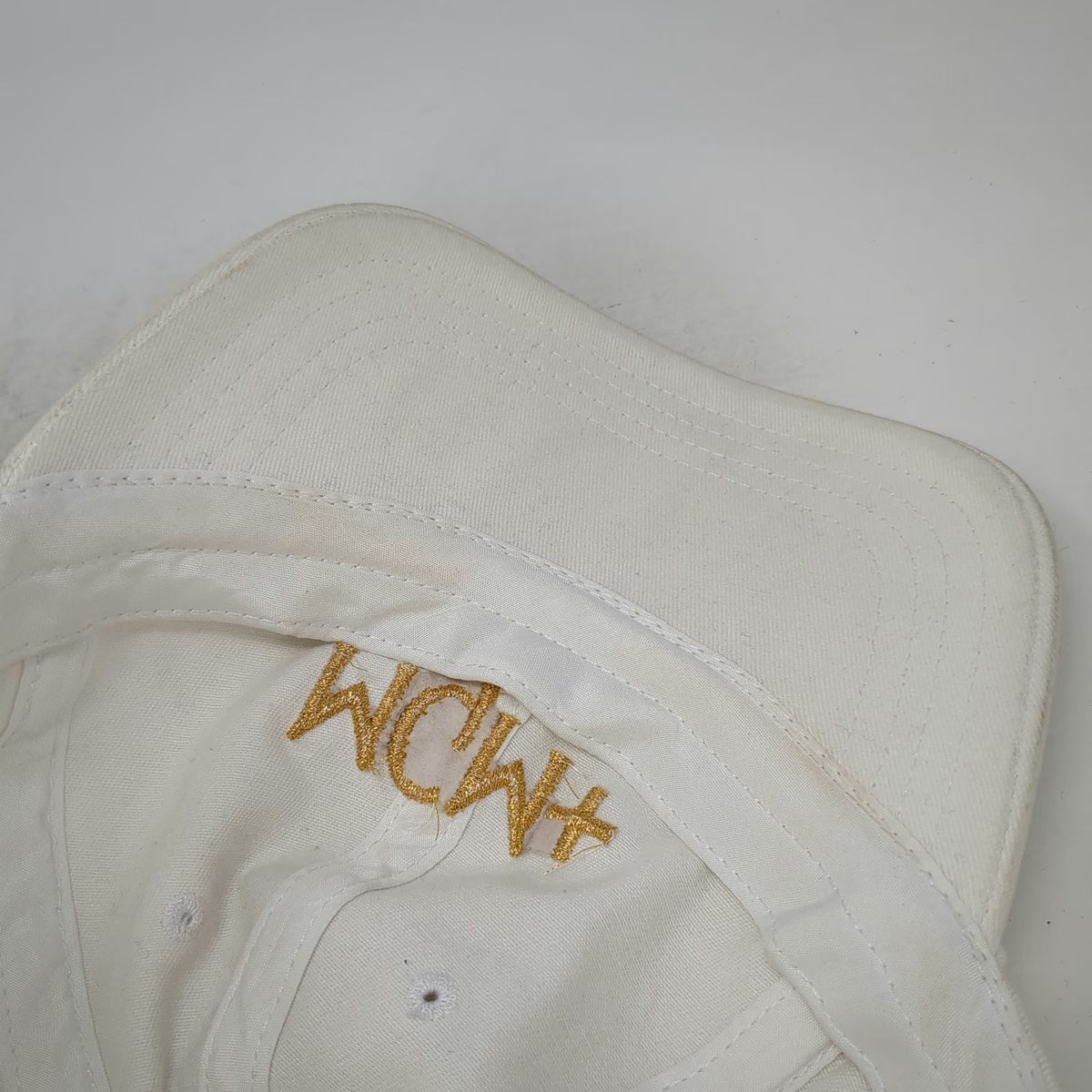 Quake City Caps MGM+ Baseball Cap White One Size Gold Embroidery Slideback Hat
