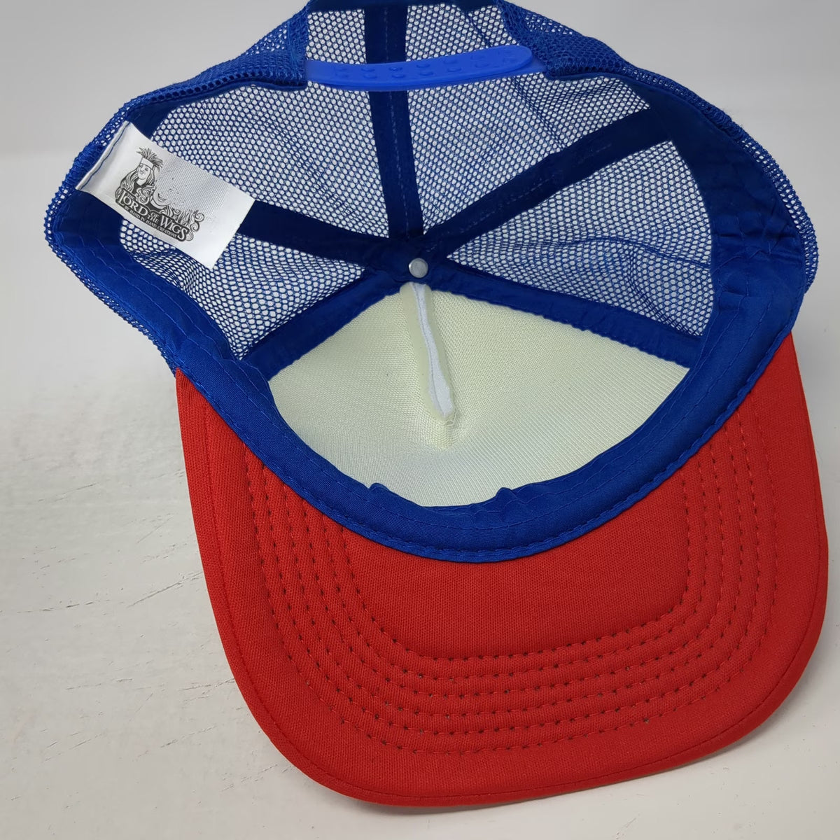 The Lord of the Wigs White Blue Red Trucker Hat One Size Merica Flag Graphic