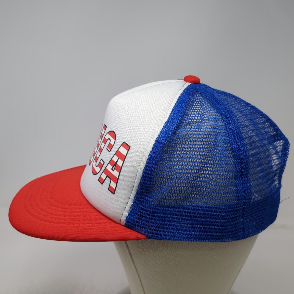 The Lord of the Wigs White Blue Red Trucker Hat One Size Merica Flag Graphic