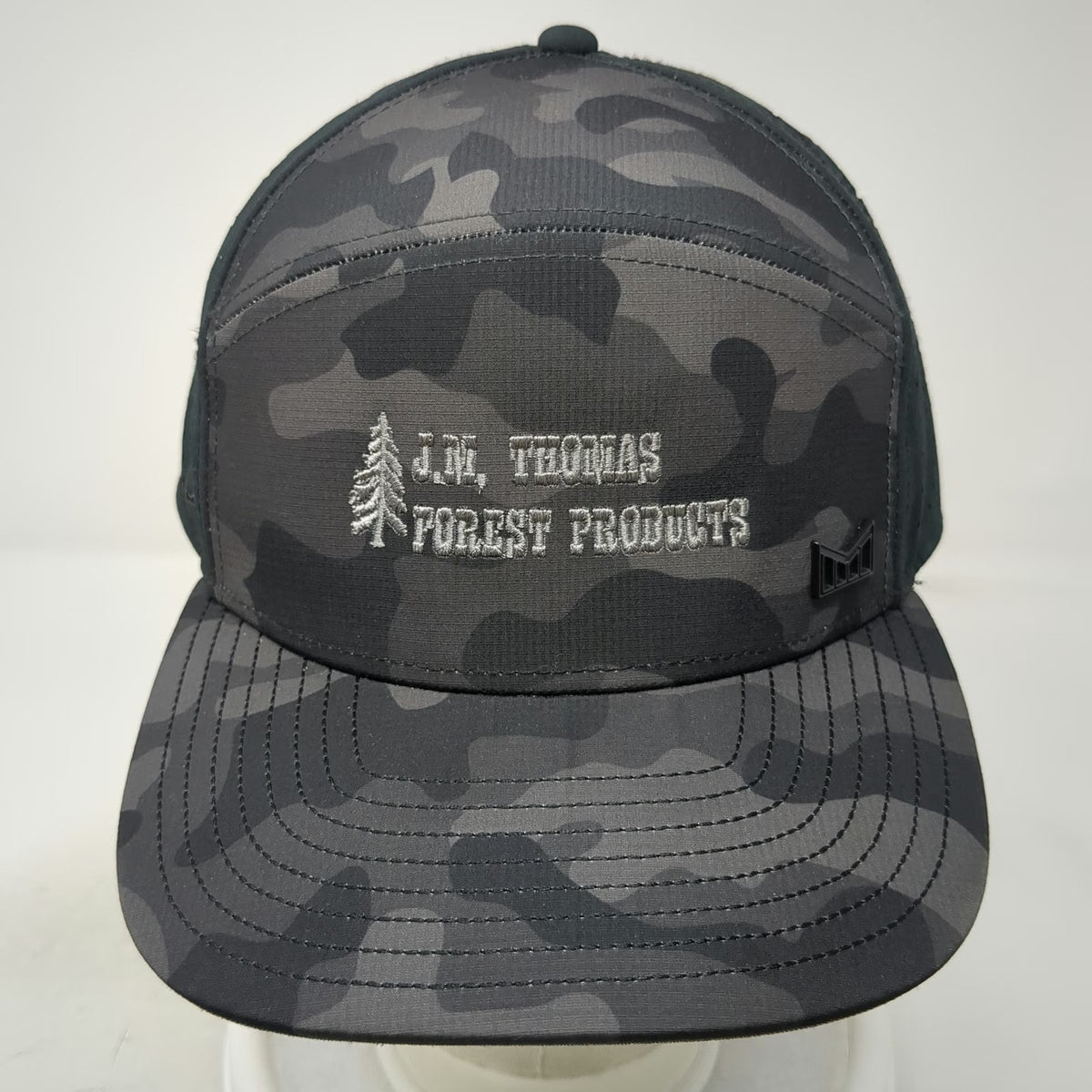 Melin Trucker Hat Black Camo 58cm JM Thomas Forest Products Pine Tree Logo