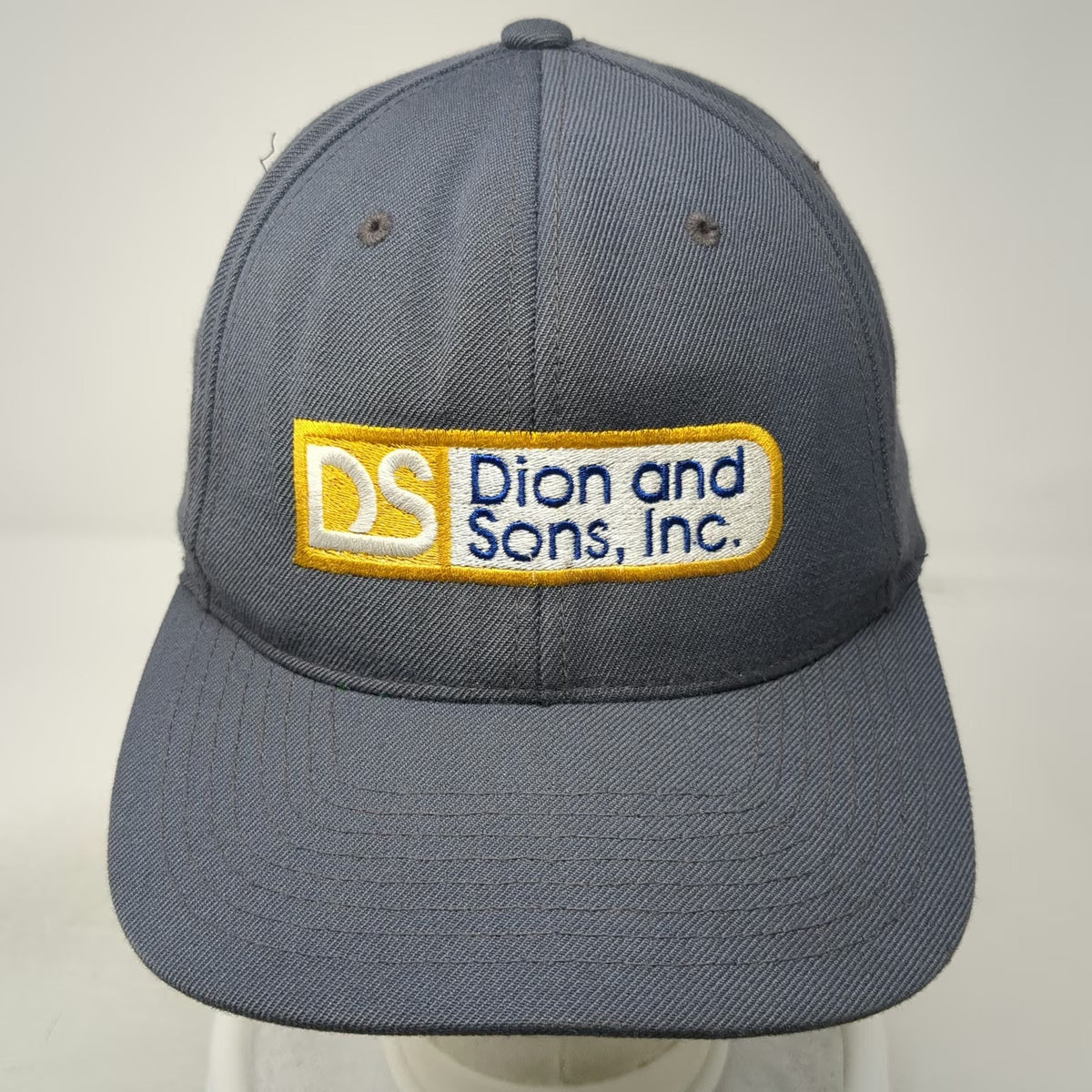 Yupoong Dion and Sons Inc Trucker Hat Gray One Size Snapback Green Under Brim