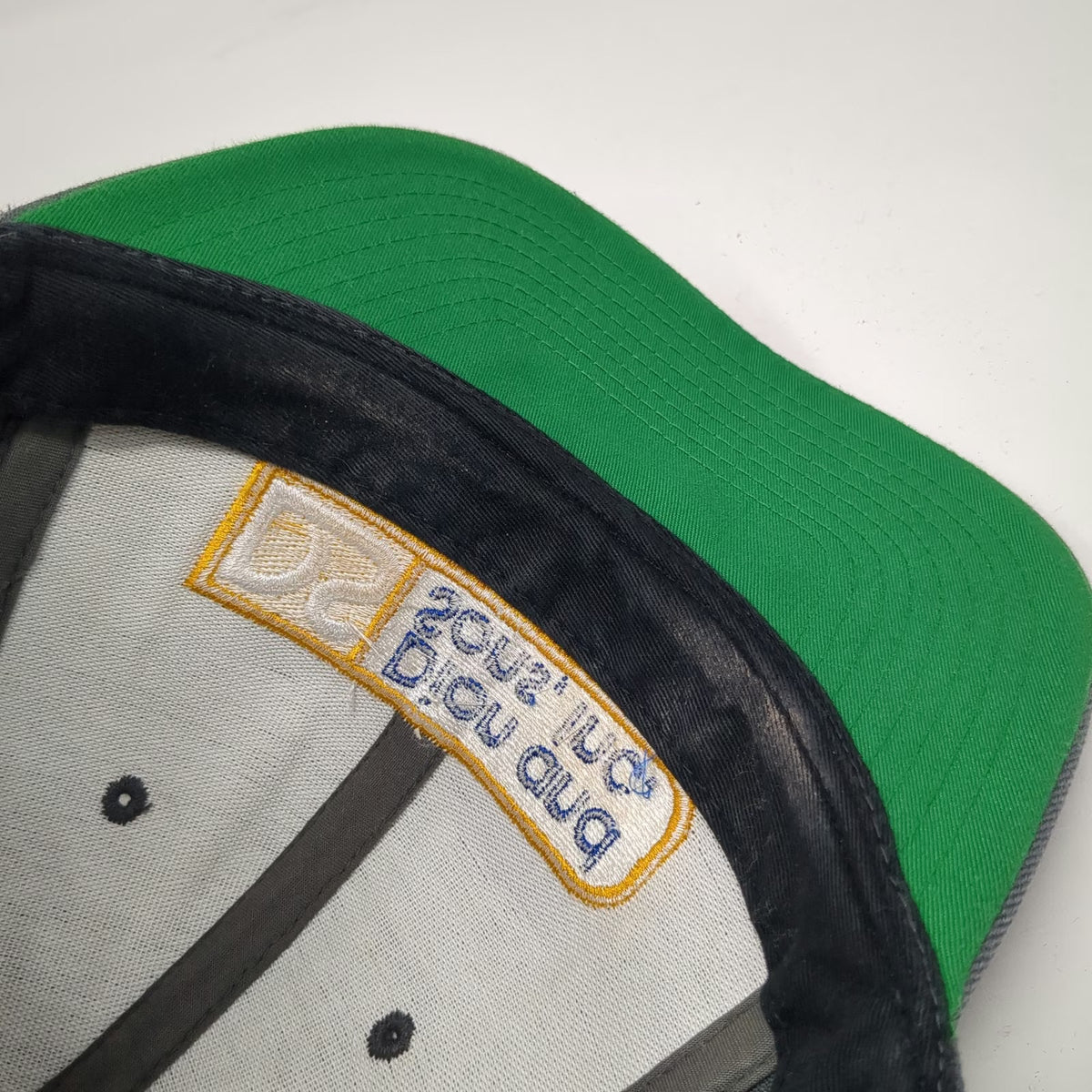 Yupoong Dion and Sons Inc Trucker Hat Gray One Size Snapback Green Under Brim