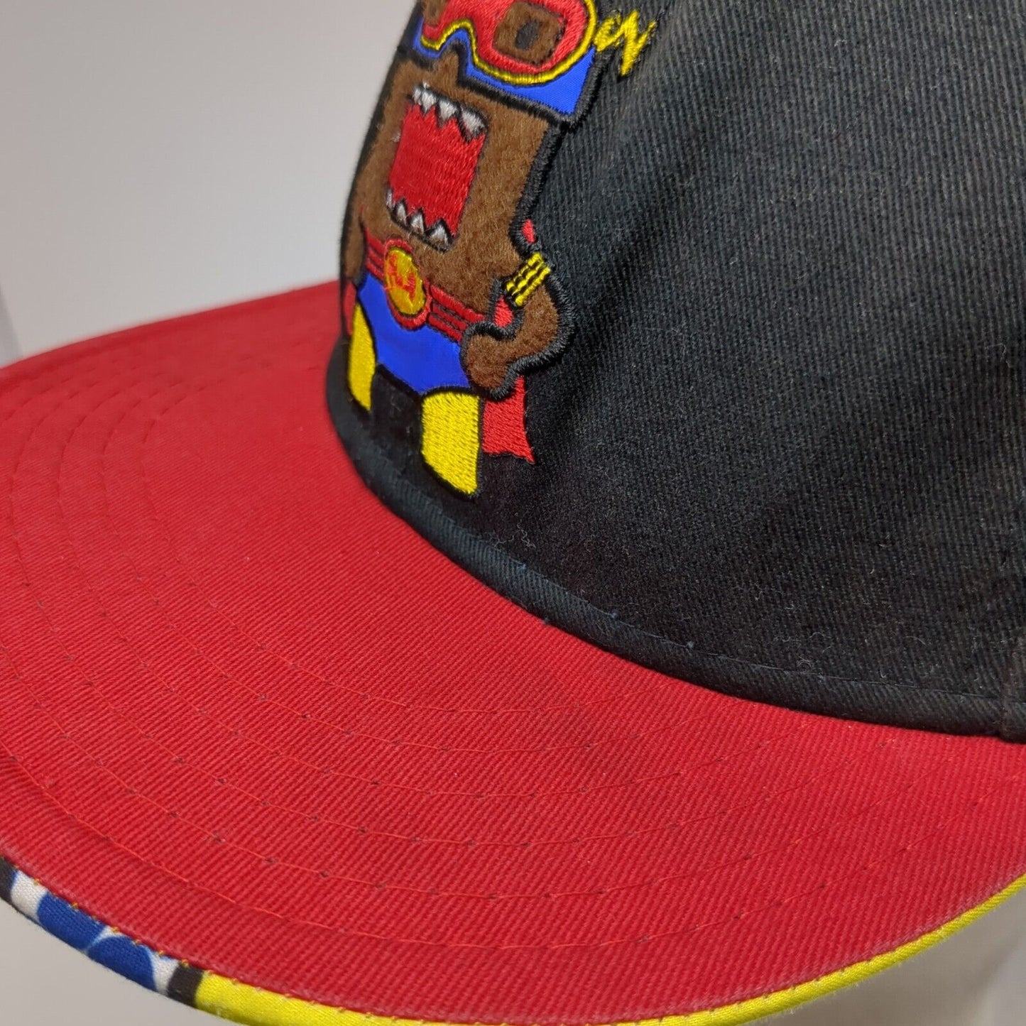 Domo Domo-Kun Snapback Hat Superhero Logo Multicolor OSFA Embroidered Logo