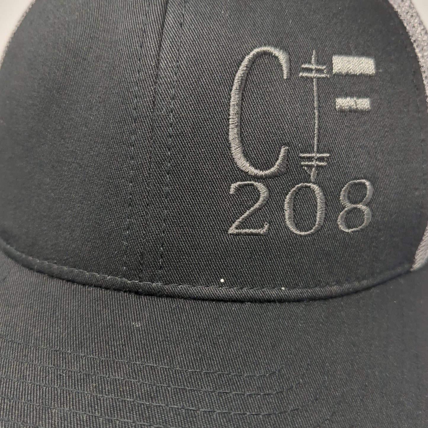C 208 Snapback Trucker Hat Black One Size Adjustable Embroidered Mesh Back