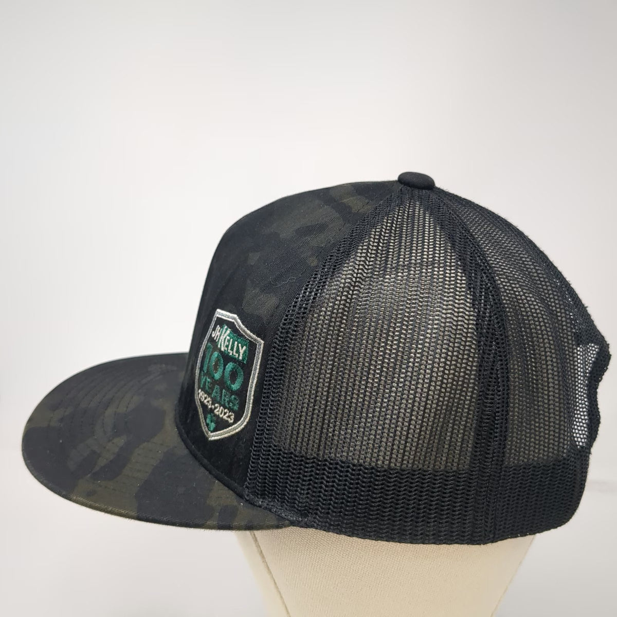 Yupoong Trucker Hat Black Camo One Size JH Kelly 100 Years 1923-2023 Mesh
