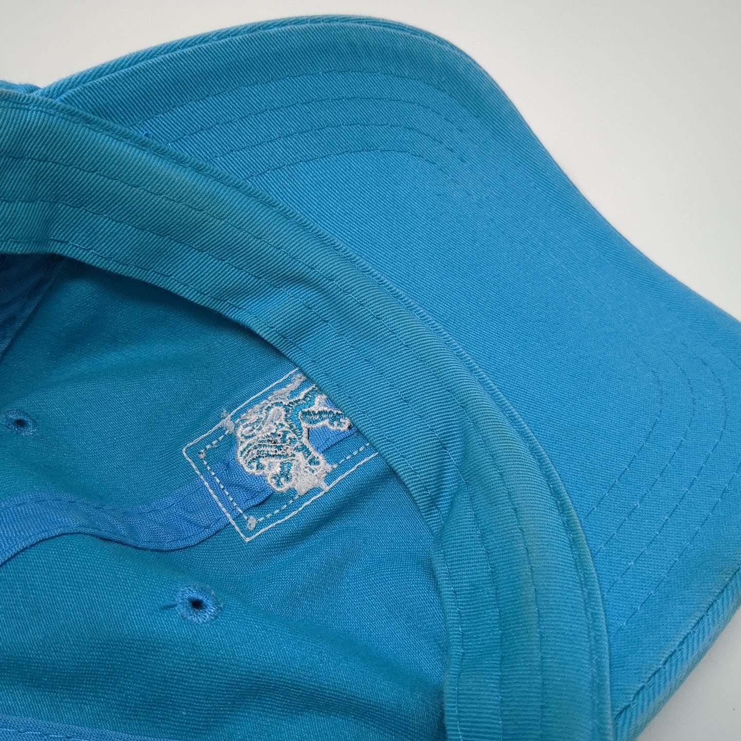Lion Patch Slideback Hat Blue One Size Adjustable American Dry Goods