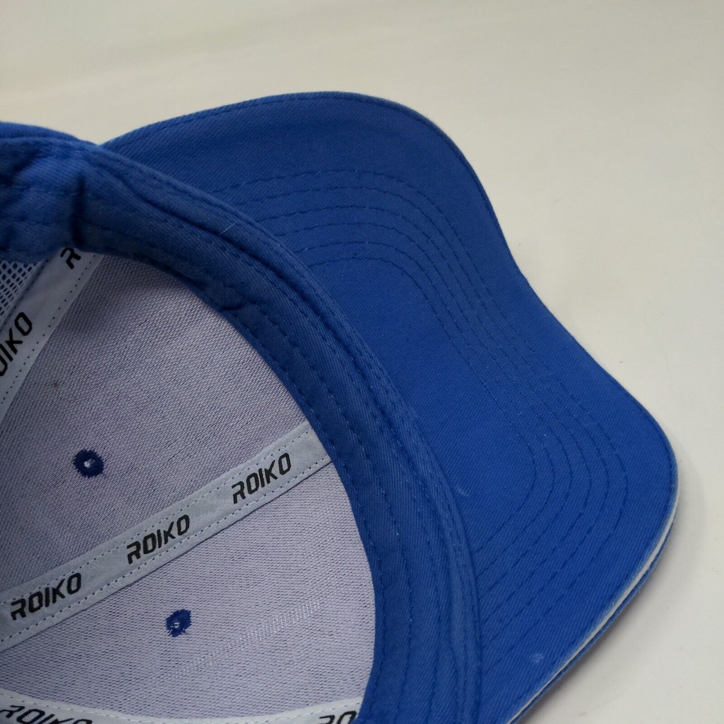 Roiko Slideback Hat Blue One Size Adjustable Emblem Vented Holes 6 Panel