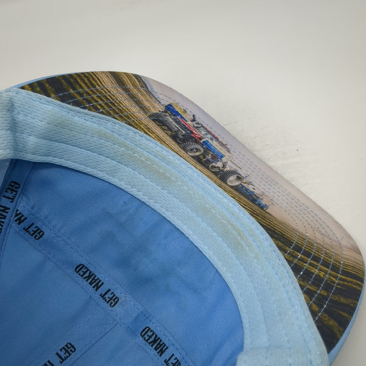 The Heartbeat Brand Trucker Hat Blue One Size Buck Naked Perforated Tractor