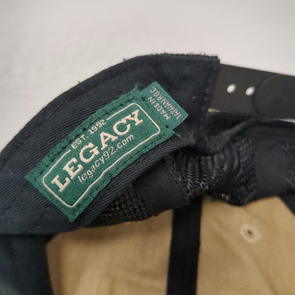 Legacy Trucker Hat Beige Black One Size Rhino Metals Patch Mesh Back Snapback