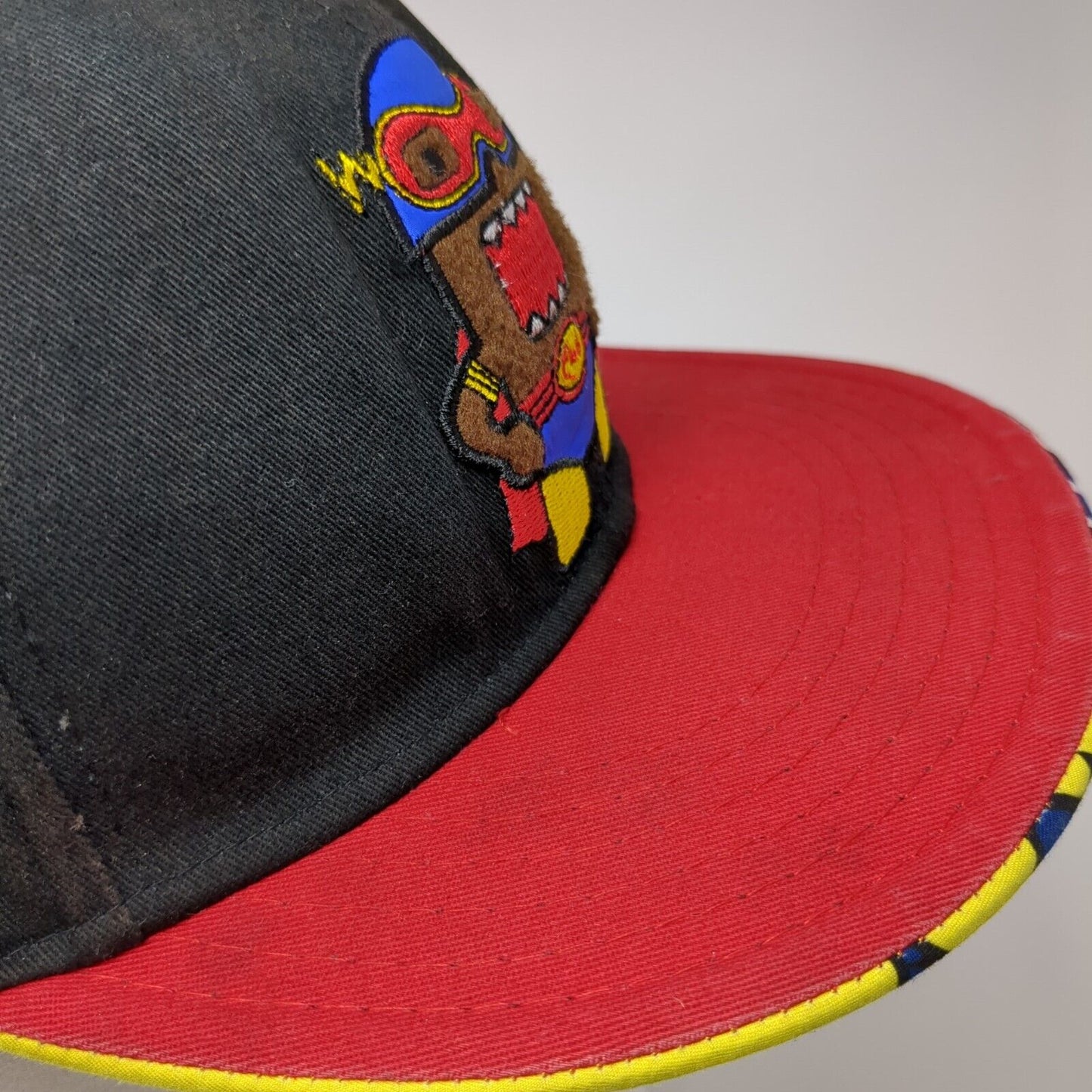 Domo Domo-Kun Snapback Hat Superhero Logo Multicolor OSFA Embroidered Logo