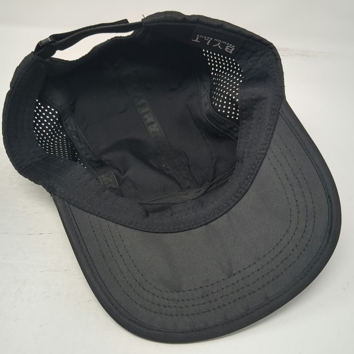 BYLT 5 Panel Black Hat One Size Slideback Laser Cut Mesh Premium Performance Cap