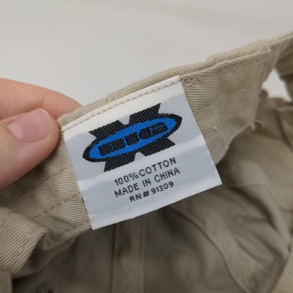 The Magnolia Roots Slideback Hat Tan One Size Embroidered 6 Panel Big X