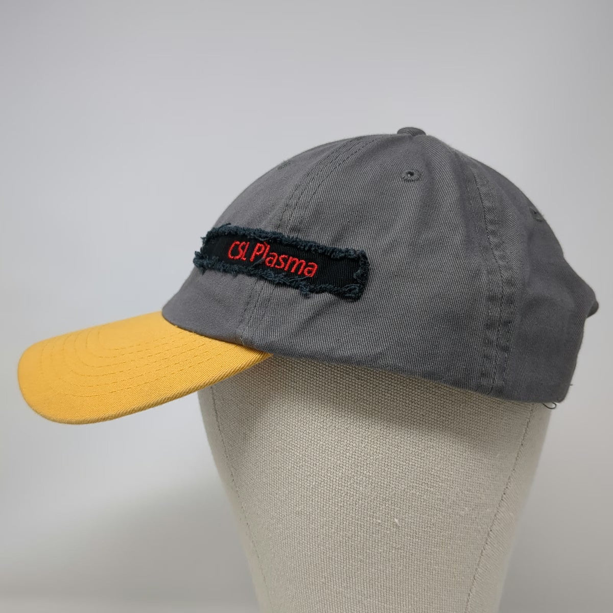 CSL Plasma Baseball Cap Gray Yellow OSFM Airplane Banner Underbill Buckle Hat