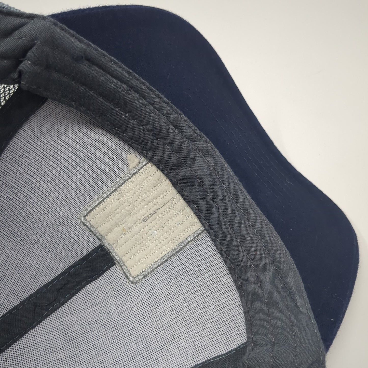 We Stand Together Reinvent The Way Our World Is Built Trucker Hat Blue OS Mesh