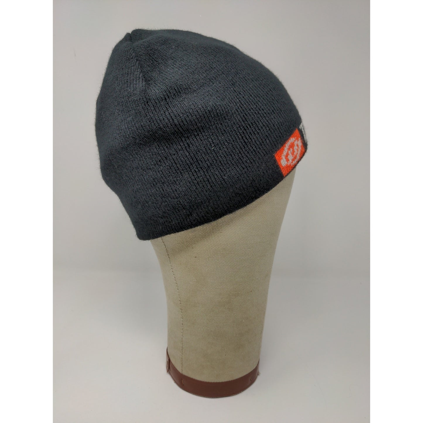 The House Striped Beanie Hat Orange & Black Spell Out Logo Knit